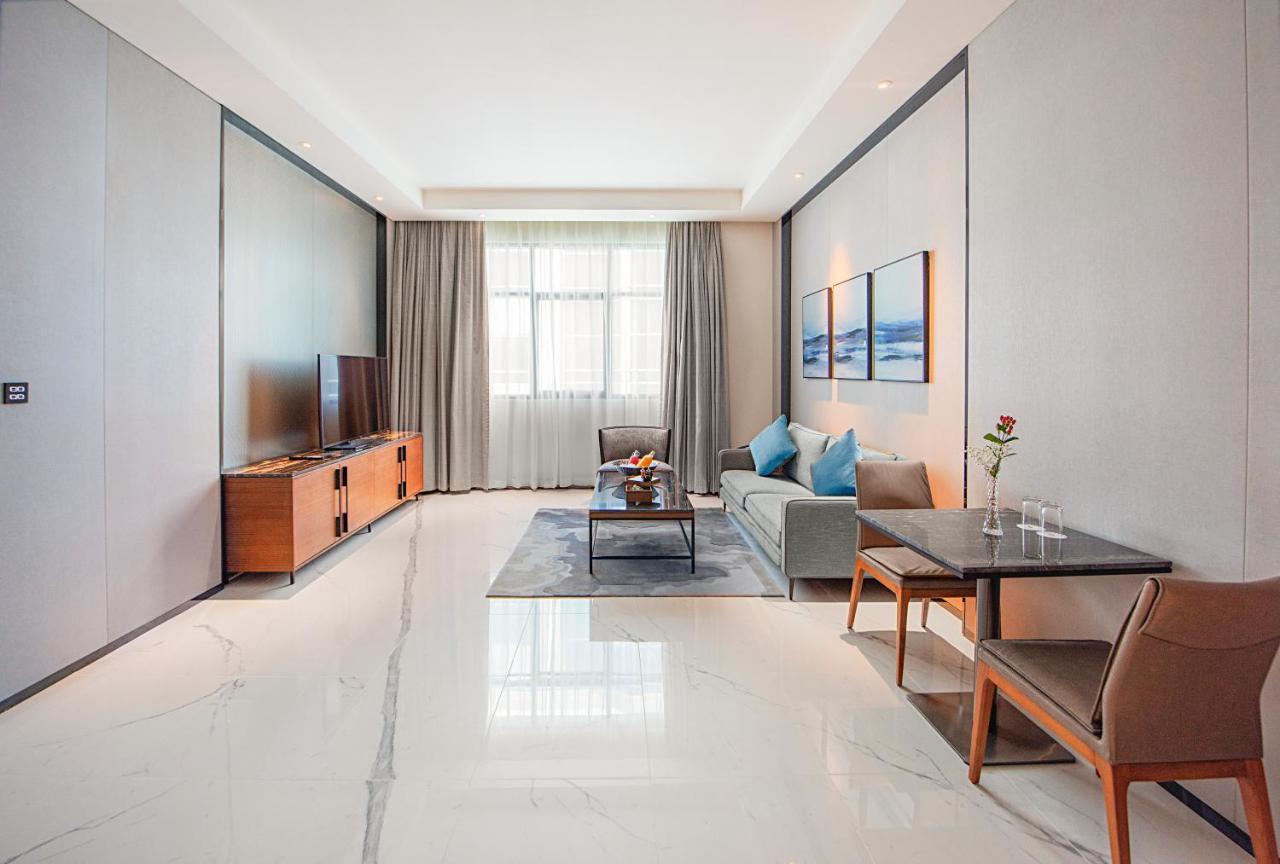 Asiana Grand Hotel Dubai Exterior photo A living room in a serviced apartment in Beijing, China